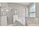 A renovated bathroom with a large walk-in shower and soaking tub at 2675 Bond St, Clermont, FL 34711