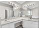 A spacious bathroom features a double vanity, glass shower, and soaking tub at 2675 Bond St, Clermont, FL 34711
