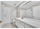 Bright bathroom featuring a long vanity with a shower-tub combination and tiled floor at 2675 Bond St, Clermont, FL 34711