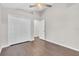 Bedroom featuring wood floors, closet, and ceiling fan at 2675 Bond St, Clermont, FL 34711