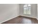 Well-lit bedroom with hardwood floors and neutral-toned walls at 2675 Bond St, Clermont, FL 34711