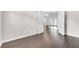 A bright, airy bedroom with hardwood floors leading to a sunny living area at 2675 Bond St, Clermont, FL 34711