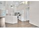 Open-concept kitchen with stainless steel appliances and white cabinets at 2675 Bond St, Clermont, FL 34711
