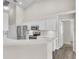 Kitchen featuring white cabinets, stainless steel appliances, and modern countertops at 2675 Bond St, Clermont, FL 34711