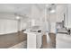 Open-concept kitchen with stainless steel appliances and white cabinets at 2675 Bond St, Clermont, FL 34711