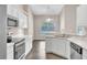 Bright kitchen featuring white cabinets and stainless steel appliances at 2675 Bond St, Clermont, FL 34711