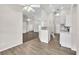 Open-concept kitchen and living room featuring hardwood floors and recessed lighting at 2675 Bond St, Clermont, FL 34711