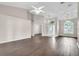 Large living area showcasing wood floors, neutral walls, and abundant natural light through arch window at 2675 Bond St, Clermont, FL 34711
