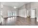 Spacious living room with wood floors, vaulted ceilings, and glass doors leading to the patio at 2675 Bond St, Clermont, FL 34711