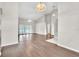Spacious living room with hardwood floors, French doors, and vaulted ceiling at 2675 Bond St, Clermont, FL 34711