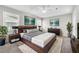 A stunning main bedroom features modern decor, a king-size bed, and stylish accents at 2675 Bond St, Clermont, FL 34711