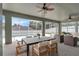 Covered patio with ample seating, ceiling fans, and views of the pool and backyard at 2675 Bond St, Clermont, FL 34711