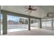 View of a screened in lanai and swimming pool, with two ceiling fans and generous space at 2675 Bond St, Clermont, FL 34711