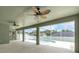 An airy screened patio, complete with two ceiling fans, overlooking the refreshing backyard pool at 2675 Bond St, Clermont, FL 34711