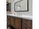 Stylish bathroom with a modern vanity, tile floors, great natural lighting and a framed mirror at 2936 Estill St, Deltona, FL 32738