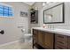 Stylish bathroom with a modern vanity, tile floors, great natural lighting and a framed mirror at 2936 Estill St, Deltona, FL 32738