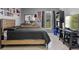Bedroom featuring hard flooring, a dresser with mirror, and a TV for entertainment at 2936 Estill St, Deltona, FL 32738