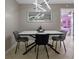 Contemporary dining area with modern lighting and gray dining chairs at 2936 Estill St, Deltona, FL 32738