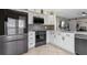 Modern kitchen with gray appliances, white cabinets, and a corner sink at 2936 Estill St, Deltona, FL 32738