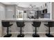 Stylish kitchen features marble countertops, a breakfast bar with seating, and an open concept layout at 2936 Estill St, Deltona, FL 32738