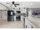 Modern kitchen featuring white cabinets, stainless steel appliances, and a spacious countertop at 2936 Estill St, Deltona, FL 32738