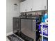 Modern laundry room with front-loading machines, overhead cabinets and tile floors at 2936 Estill St, Deltona, FL 32738