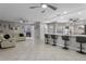 An open-concept living space features tile floors, ceiling fans, and a breakfast bar at 2936 Estill St, Deltona, FL 32738