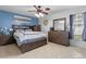 Spacious main bedroom with a blue accent wall, tile floors and lots of natural light at 2936 Estill St, Deltona, FL 32738
