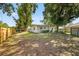 Large backyard featuring a well-maintained lawn and a privacy fence at 3029 Pinetree, Winter Haven, FL 33884