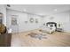 Spacious bedroom with wood-look flooring, a door to the exterior, and bright natural light at 3029 Pinetree, Winter Haven, FL 33884