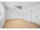 Airy bedroom features wood floors, a ceiling fan, and closet space at 3029 Pinetree, Winter Haven, FL 33884