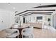 The living room flows to the dining area with a wooden table and modern chairs at 3029 Pinetree, Winter Haven, FL 33884
