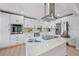 Modern kitchen featuring quartz countertops, stainless steel appliances, and white cabinetry at 3029 Pinetree, Winter Haven, FL 33884