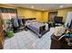 Spacious bedroom featuring tile flooring, a large bed, and ample closet and storage space at 306 Aylesbury Ct, Kissimmee, FL 34758
