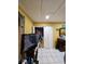 Bedroom showcasing the tile flooring, television, closet and storage spaces at 306 Aylesbury Ct, Kissimmee, FL 34758