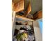 Shelved storage closet with miscellaneous items and attic access at 306 Aylesbury Ct, Kissimmee, FL 34758