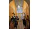Inviting entryway with neutral decor and stylish lighting fixture at 306 Aylesbury Ct, Kissimmee, FL 34758
