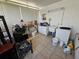 Enclosed laundry room featuring a tile floor, window and a washing machine at 306 Aylesbury Ct, Kissimmee, FL 34758