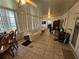 Inviting sunroom with tile flooring, large windows and ceiling fans at 306 Aylesbury Ct, Kissimmee, FL 34758