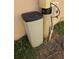 Close up view of a water softener system, located outside at 306 Aylesbury Ct, Kissimmee, FL 34758