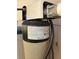 Close up of a Rain Soft water treatment system with technical data at 306 Aylesbury Ct, Kissimmee, FL 34758