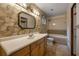 A bathroom featuring a tub shower and vanity with great lighting at 32125 Okaloosa Trl, Sorrento, FL 32776