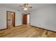 A bright bedroom with wood floors and multiple entrances at 32125 Okaloosa Trl, Sorrento, FL 32776