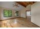 Bedroom with light-colored walls, wood floor and a ceiling fan at 32125 Okaloosa Trl, Sorrento, FL 32776