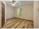 Bedroom with a window and wood floors at 32125 Okaloosa Trl, Sorrento, FL 32776