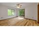 Light and bright bedroom with wood floors, outdoor access, and a ceiling fan at 32125 Okaloosa Trl, Sorrento, FL 32776