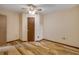 Bedroom features wood floors and a ceiling fan at 32125 Okaloosa Trl, Sorrento, FL 32776