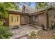 Charming front entrance with double doors, stone walkway and mature landscaping at 32125 Okaloosa Trl, Sorrento, FL 32776
