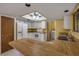 Bright kitchen featuring an island, white appliances, and lots of natural light at 32125 Okaloosa Trl, Sorrento, FL 32776