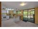 Kitchen featuring white cabinets, light countertops, and sliding glass doors at 32125 Okaloosa Trl, Sorrento, FL 32776